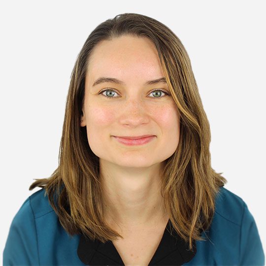 smiling female veterinarian looking straight ahead