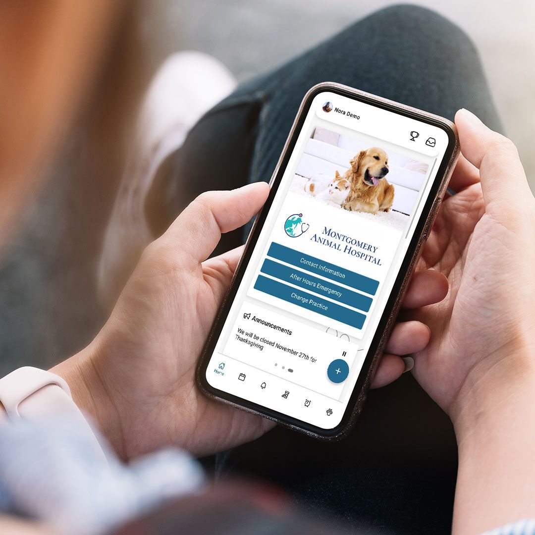 woman holding a phone with the PetPage app open