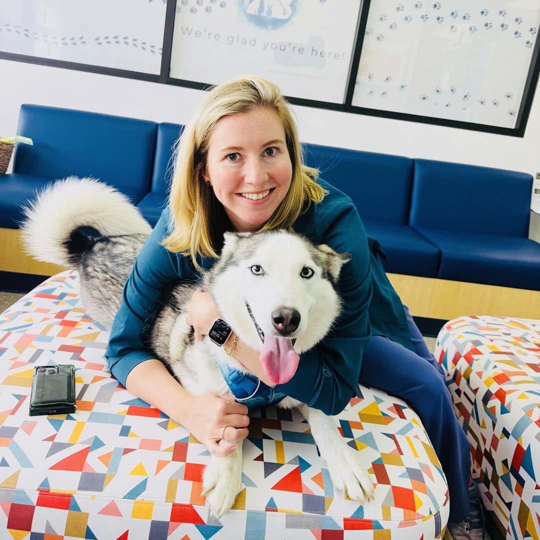veterinarian with one of her favorite Husky patients
